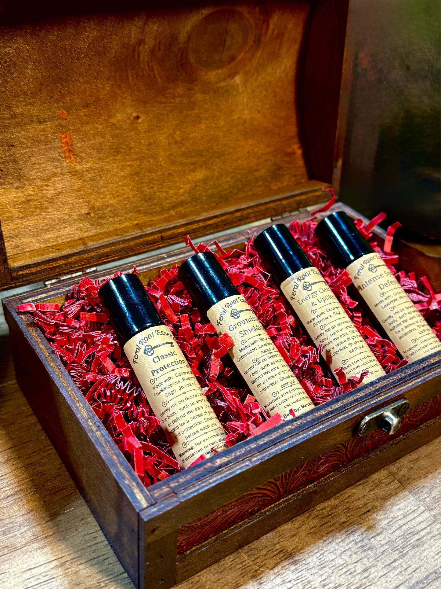 Limited Edition wooden treasure chest containing Protection and Energy oil rollers – handcrafted essential oil blend set by Feral Root Essentials