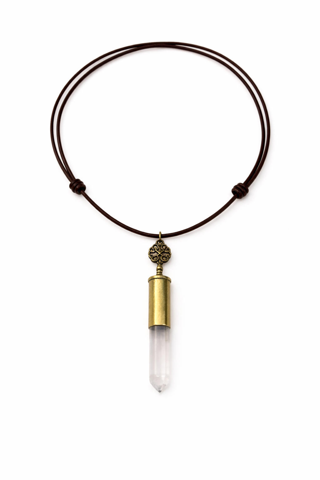 Necklace with a clear crystal pendant and brass accent on a white background