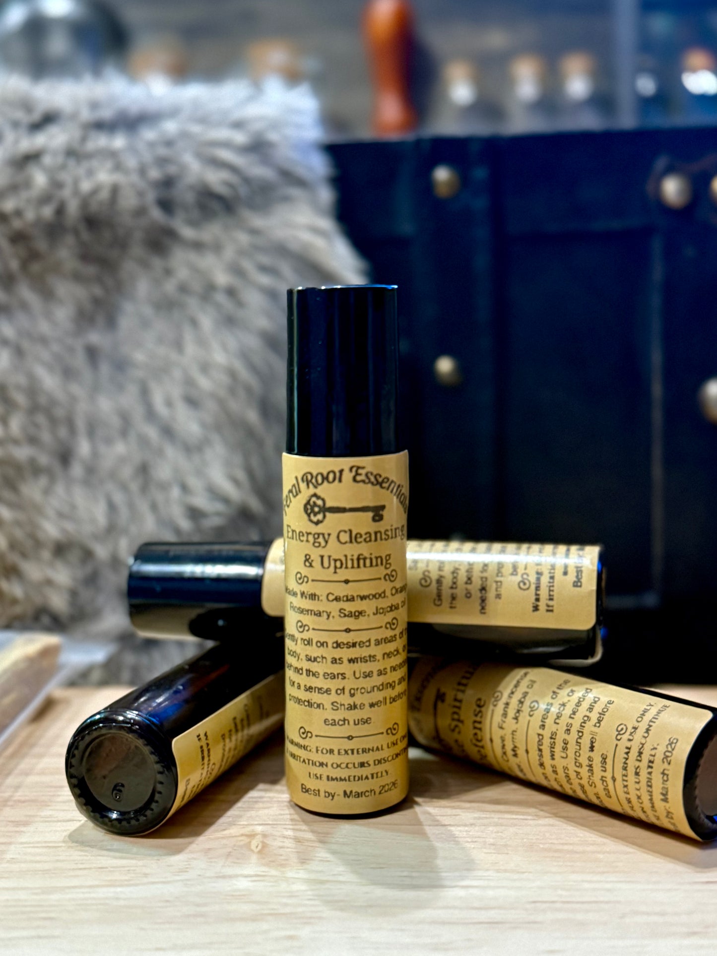 Energy Cleansing and Uplifting essential oil roller with cedarwood, orange, rosemary, and sage – refreshing spiritual blend by Feral Root Essentials