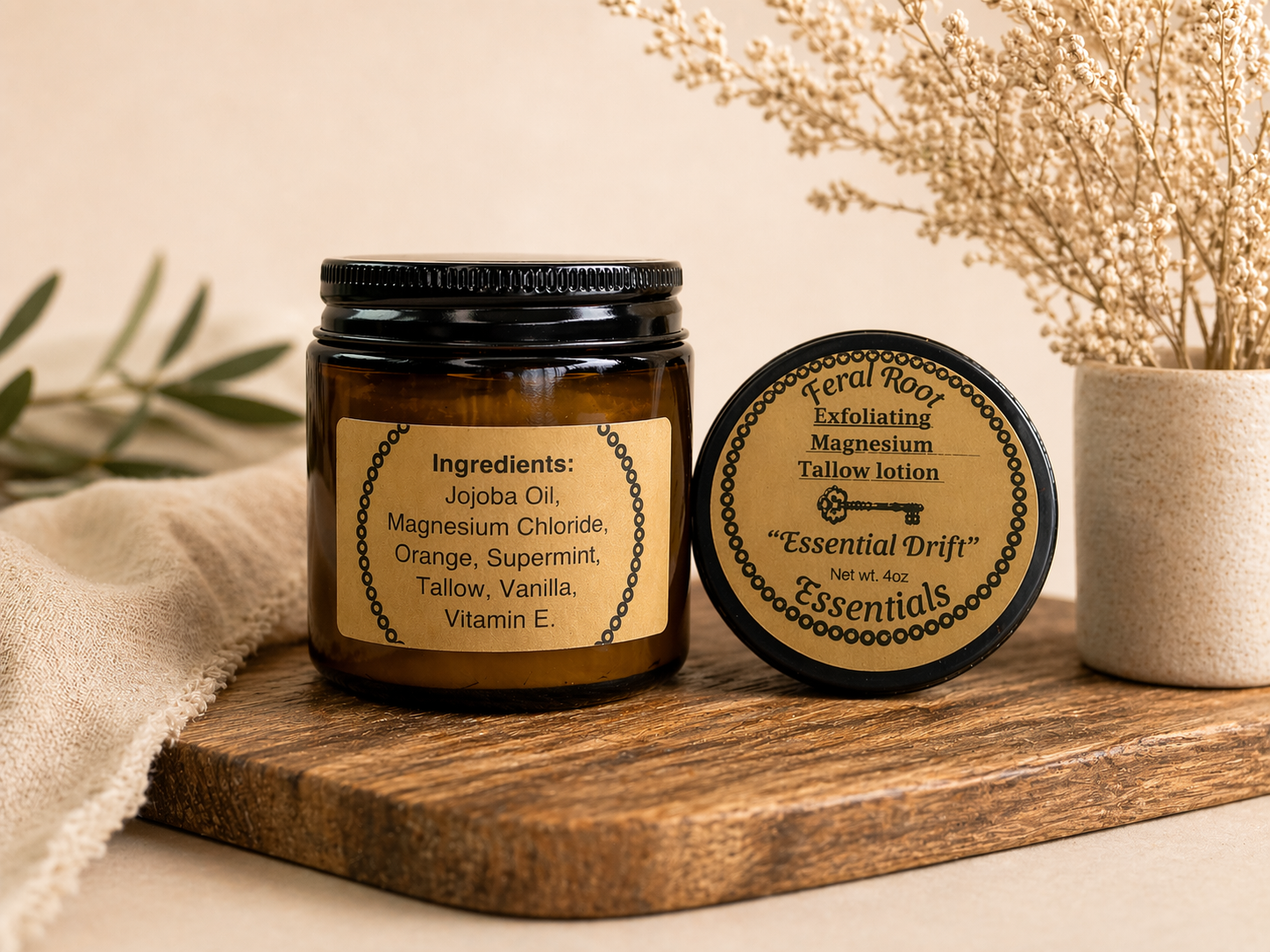 Two jars of 'Essential Drift' products on a wooden surface with a neutral background.