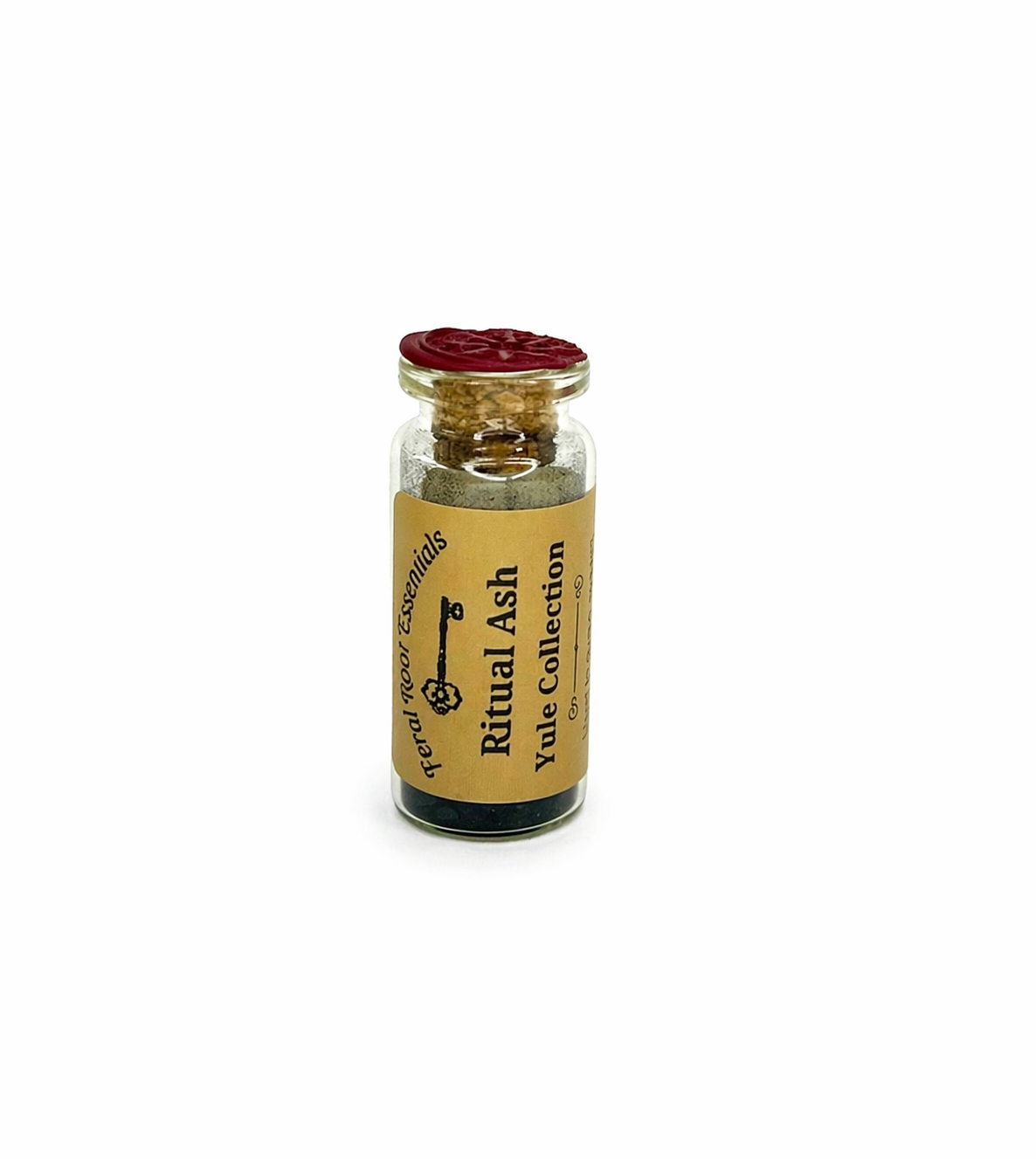 Small glass bottle labeled 'Ritual Ash' with a red cap on a white background