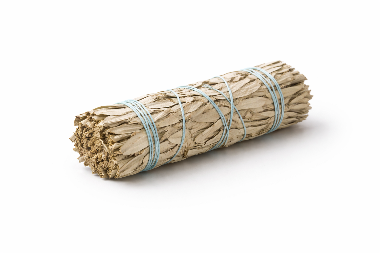 Bundled sage stick on a white background